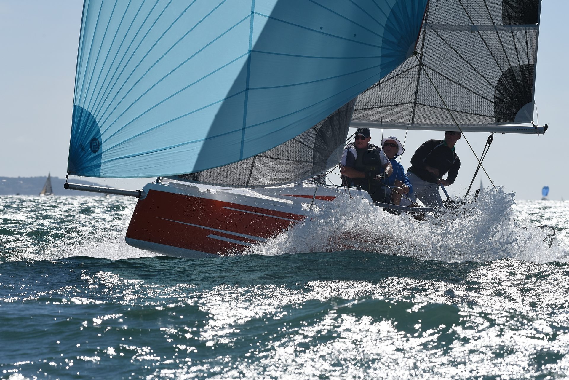 Fareast 19R sailing downwind under a blue spinnaker