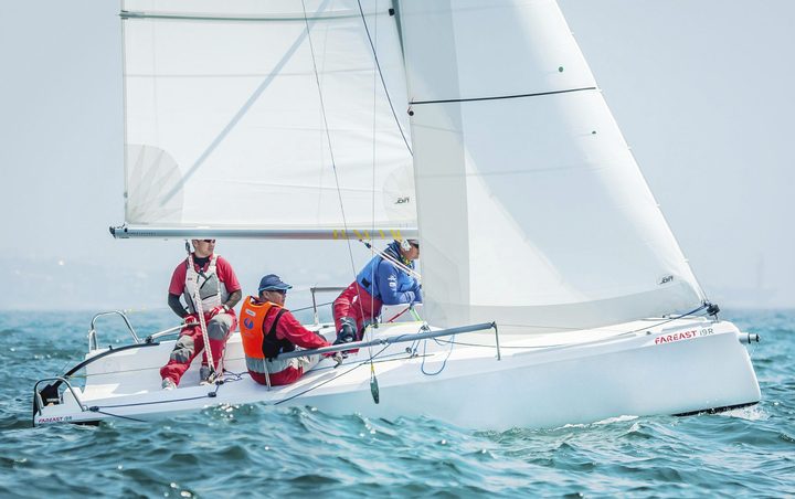 Fareast sailing boat racing in choppy water