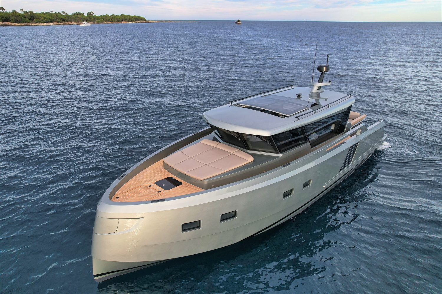 Glacier 48 motor yacht at anchor in clear water