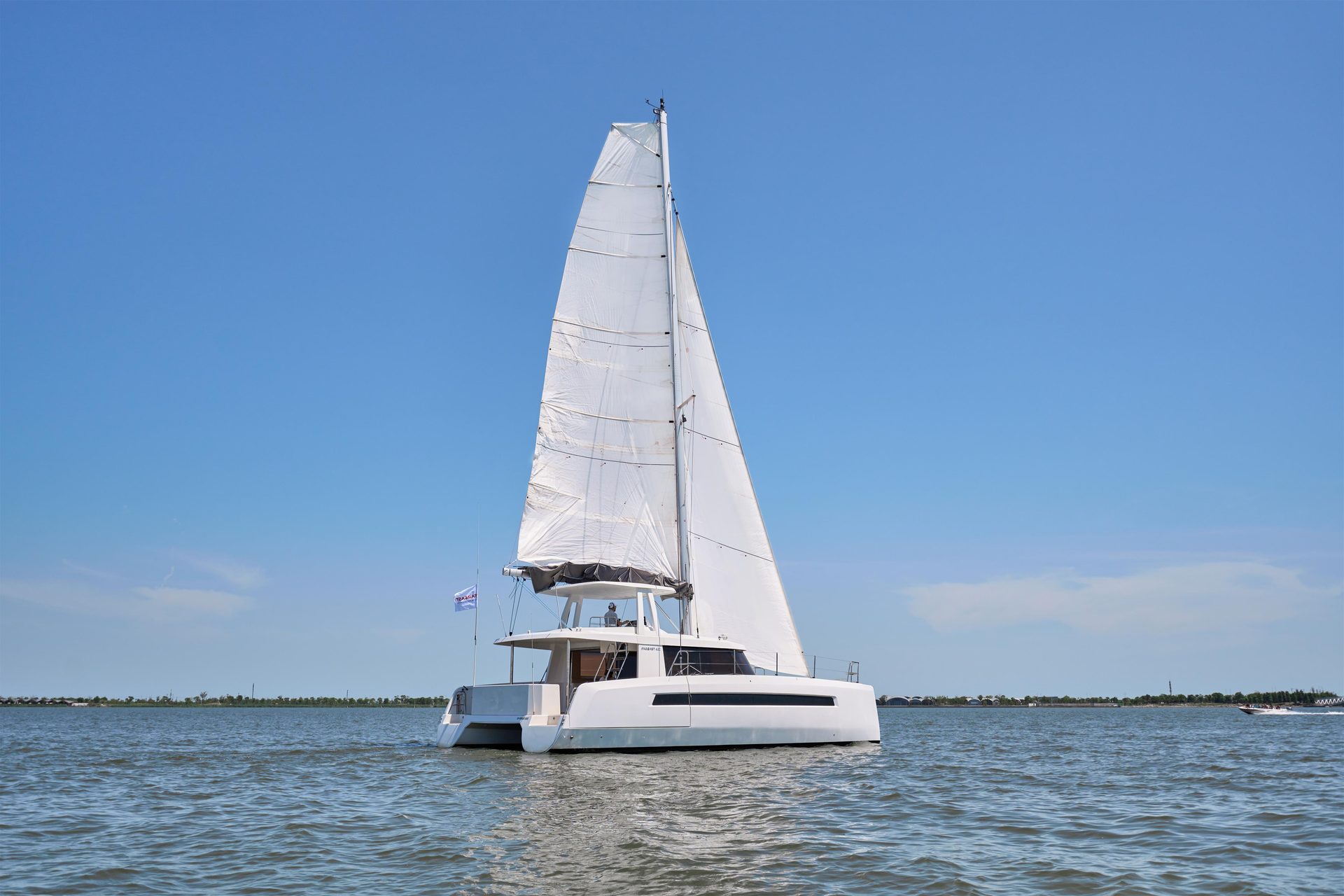 NYX catamaran sailing on open water