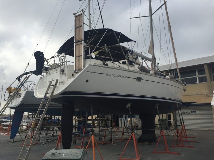 Sailing yacht supported on stands ashore